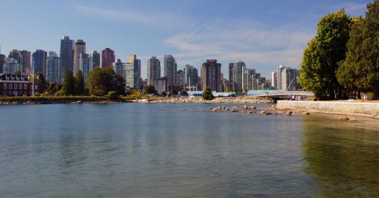 Vancouver skyline viewed across the water from Stanley Park in British Columbia.