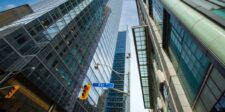 Canada’s C$500B investment push puts SME financing in focus Skyscrapers along Bay Street in Toronto’s financial district viewed from street level.