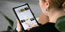Google Search profiles drop to 10,000 followers for U.S. publishers and creators Woman browsing Google Search on a tablet.