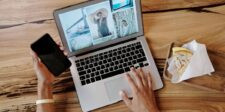 Gyazo breach exposes 23.62 million user records and image metadata Person viewing a photo gallery on a laptop while holding a smartphone.