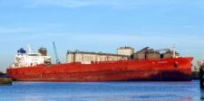 Hormuz shipping traffic is still far below normal despite signs of adaptation Crude oil tanker On Precious docked beside industrial port facilities.