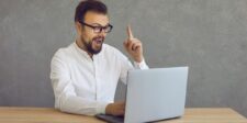How to password protect a website without creating bigger problems Man at a laptop raising one finger as if he has an idea.