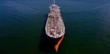 Tracked Hormuz shipping drops back toward zero Aerial view of a large oil tanker travelling alone across open water.
