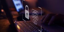 AI agents can now request 1Password logins without seeing the secret Padlock and masked password fields over a laptop keyboard.
