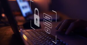 Padlock and masked password fields over a laptop keyboard.