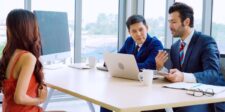 Job candidate meeting with interviewers in an office, illustrating Canada’s weaker hiring market after September job losses.