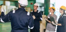 Canada opens applications for workforce retention and retraining support Supervisor in a hard hat leading a training session with factory workers