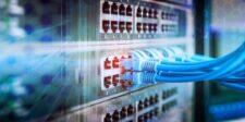Cisco SD-WAN Manager zero-day could give attackers admin API access Blue Ethernet cables connected to enterprise network equipment, illustrating the Cisco SD-WAN Manager authentication bypass vulnerability.