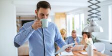 Break-even analysis explained for small business owners Small-business owner reviewing financial information on a tablet while working with a team.