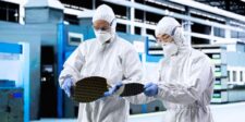 Micron strike authorization raises pressure at Taiwan AI memory hub Semiconductor workers inspecting silicon wafers in a cleanroom, illustrating labour pressure at Micron’s Taiwan memory operations.
