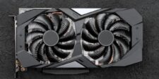 Graphics card with two cooling fans on a dark textured surface.
