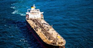Large crude oil tanker sailing through open water, illustrating surging tanker charter rates and shipping pressure around the Strait of Hormuz.