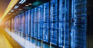 Rows of data center server racks, illustrating the scale of AI infrastructure behind SpaceX’s reported Nvidia chip financing plans.